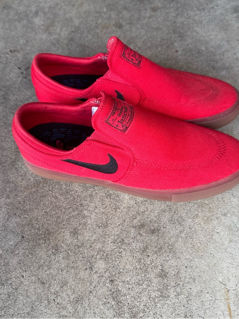 Nike Red Slip-On Canvas Sneakers with Black Swoosh